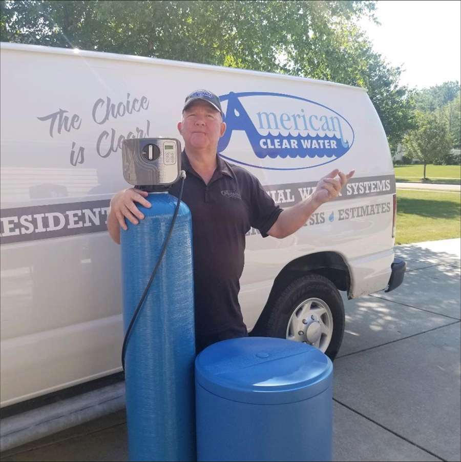 Owner Greg Naples with a whole house water filter.